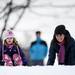 Four-year-old Lauren Lund gets a push from her mother while visiting Ann Arbor on Friday Dec. 28. Daniel Brenner I AnnArbor.com